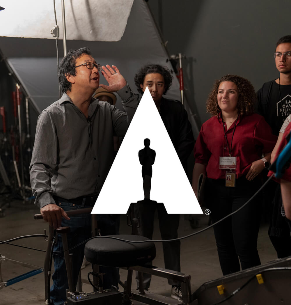 Cinematographer Michael Goya trains students on set
